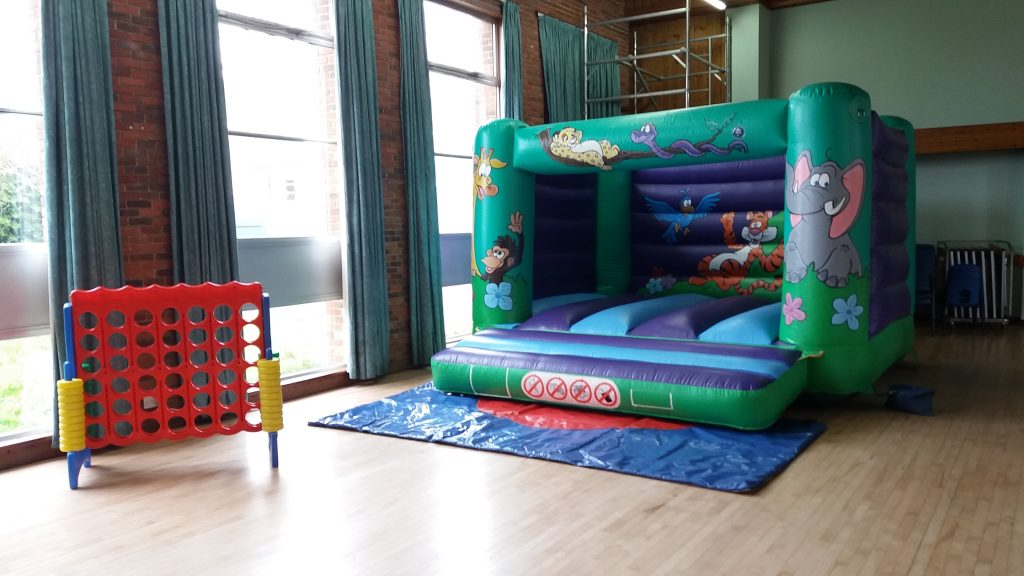 Jungle bouncy castle hire with giant connect four game on hire at Peartree Church Hall