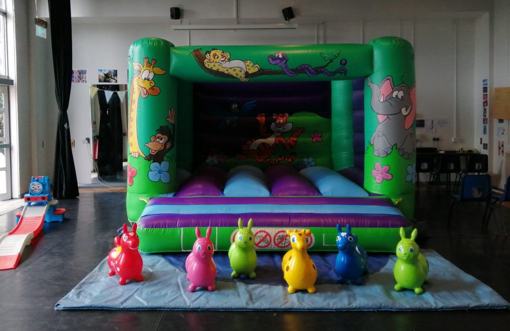 Jungle Bouncy Castle with animal hoppers and Thomas the Tank Roller Coaster for pre school party at Tauntons College