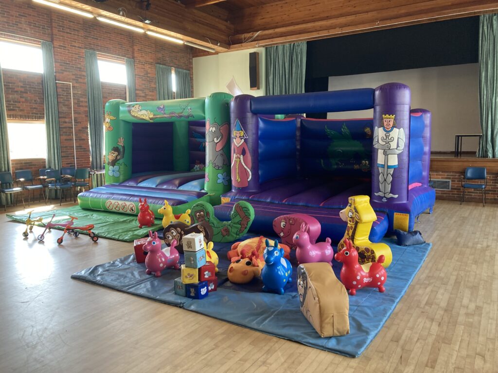 Two bouncy castles with soft play for birthday party in Peartree Church Hall